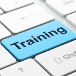 Depicting online training with a keyboard key that says Training