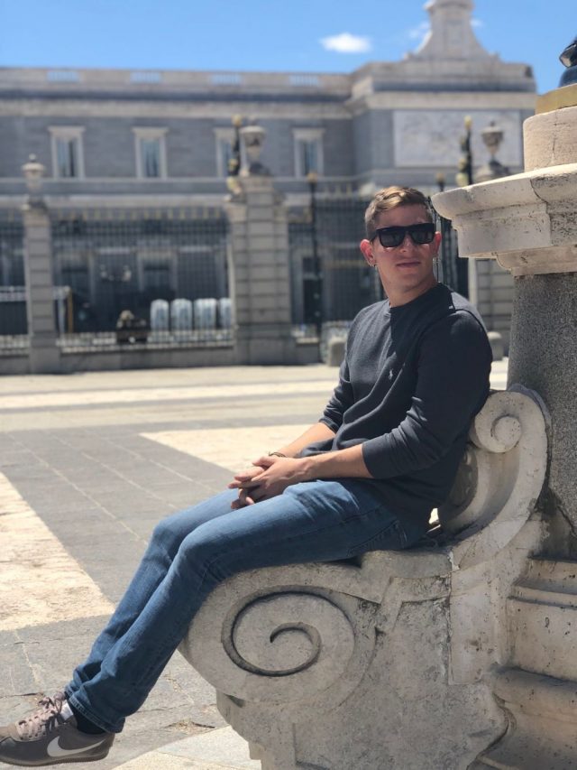 Student sitting outside of Palacio Real in Madrid, Spain