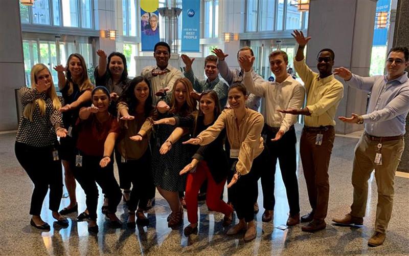 A group of Warrington graduates who were hired at Procter and Gamble.