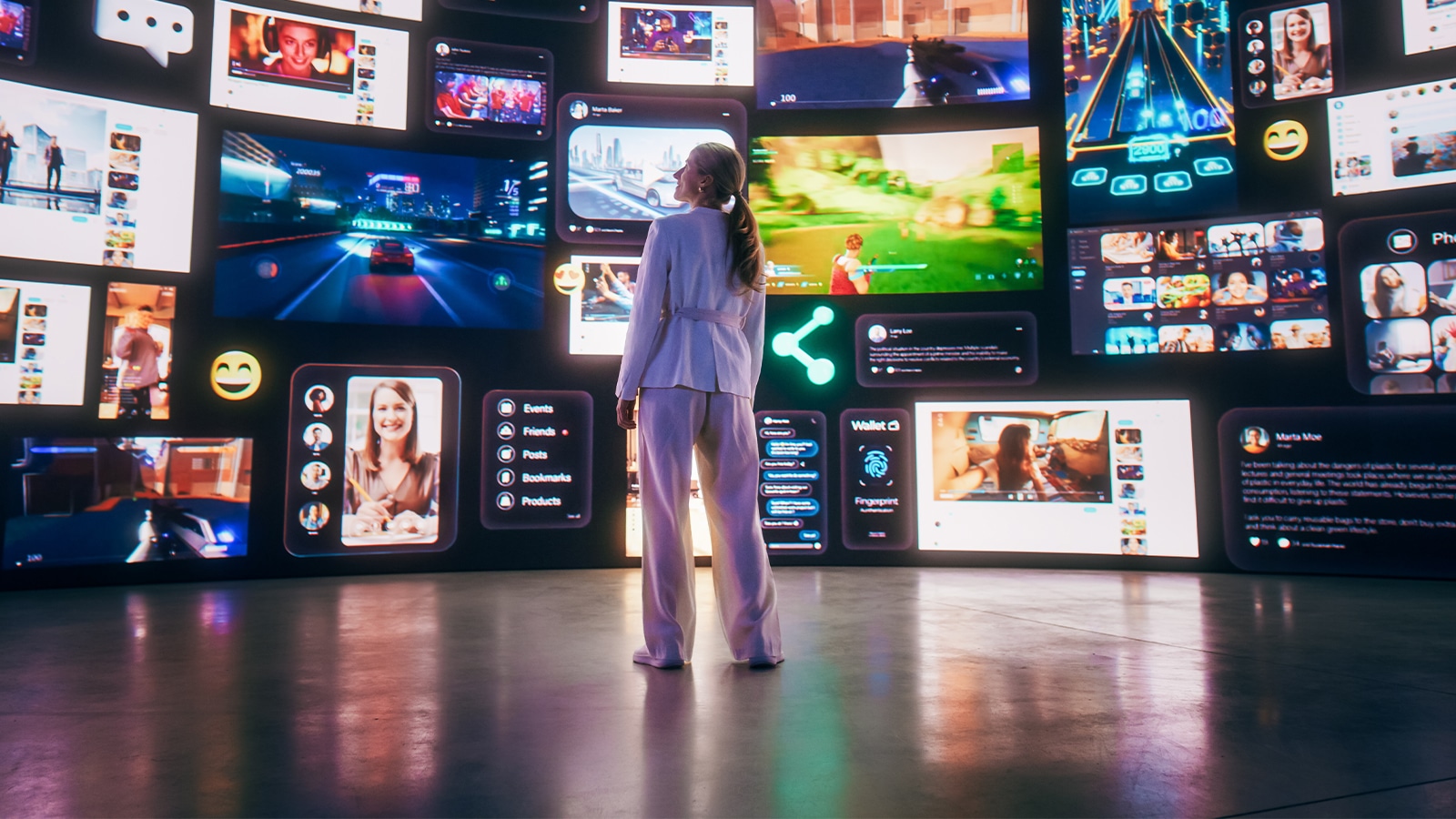 A woman in a white suit stands in a futuristic room surrounded by glowing digital screens displaying entertainment, social media, gaming, and communication interfaces.