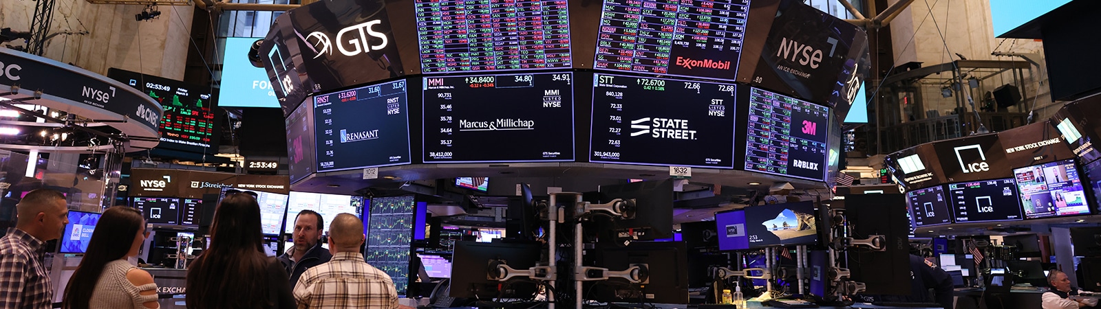 Monitors display New York Stock Exchange and more data relevant to students in UF Warrington's MS in Finance program