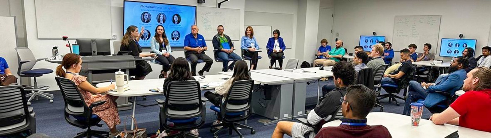 A panel of speakers at an event. 