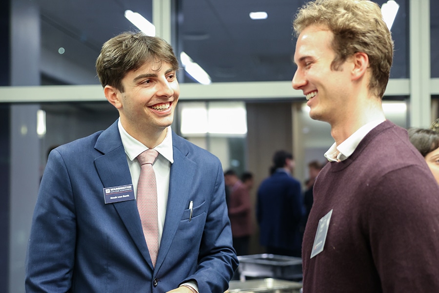 Smiling student working with a recruiter. 