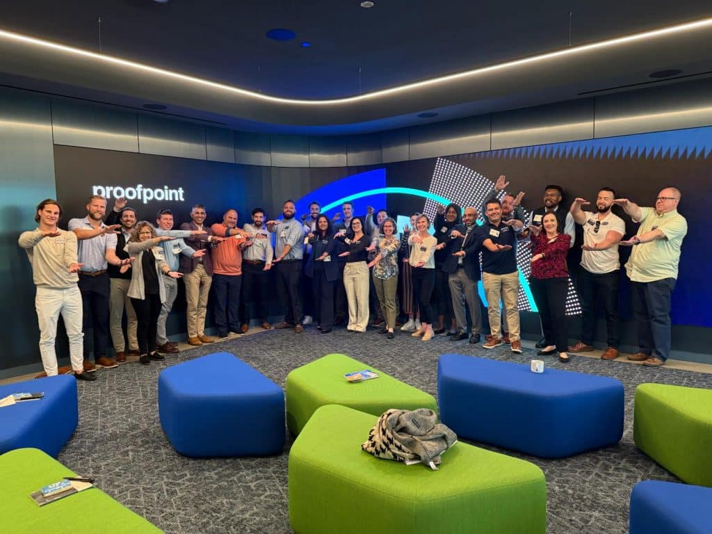 A large group of students do the Gator Chomp at Proofpoint's corporate offices. 