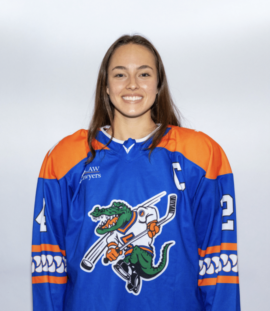 Sarah Pagels smiling with hockey uniform