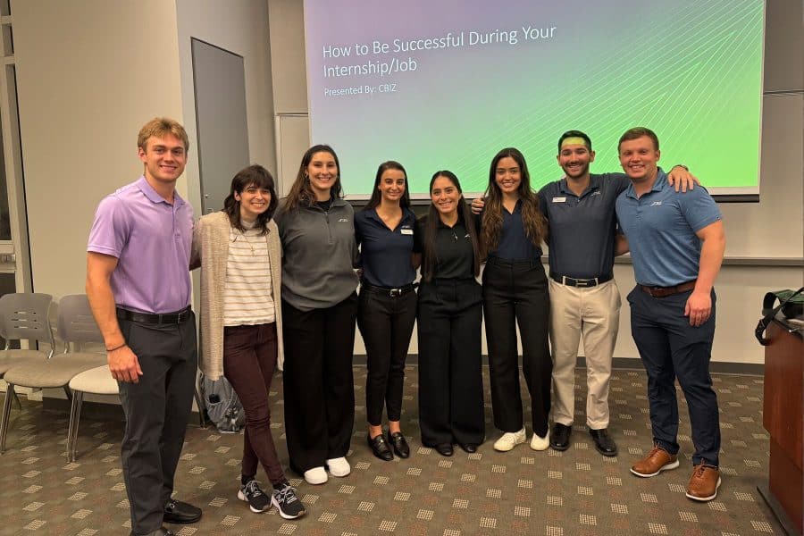 group picture with exploring accounting class standing and smiling with CBIZ presenters