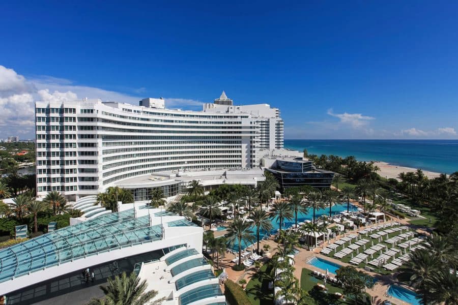 The Fontainebleau on Miami Beach with pools, palm trees and the Atlantic Ocean.