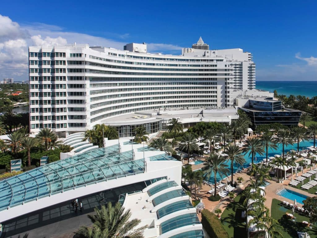 The Fontainebleau on Miami Beach with pools, palm trees and the Atlantic Ocean.
