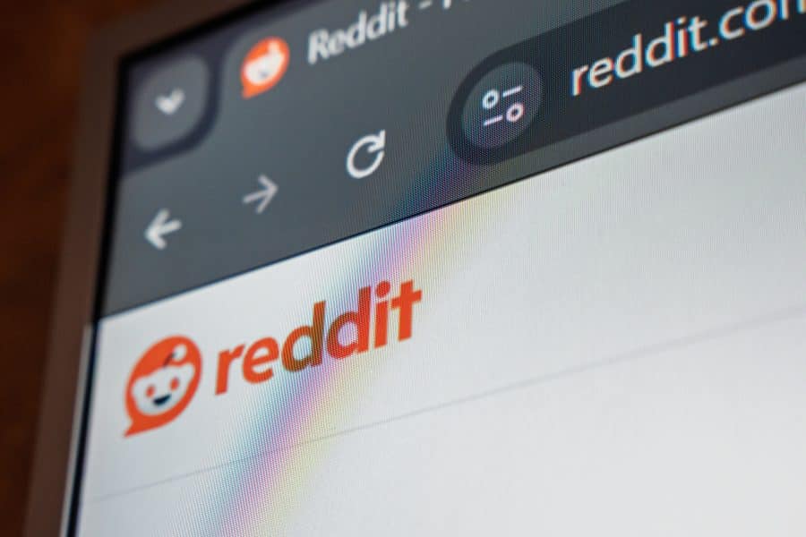 Close up view of Reddit website on digital screen showing logo and interface elements.