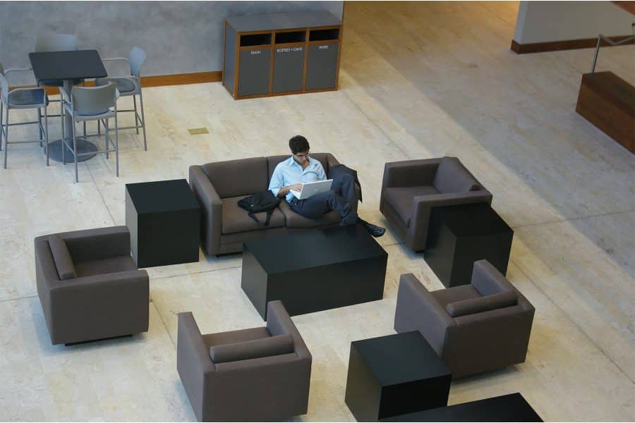 Man sitting and doing work on laptop